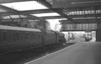 A Glasgow - Stranraer Harbour boat train prepares to leave Ayr station on Saturday 25 May 1963. Locomotive in charge is Ardrossan Black 5 no 45251.<br><br>[R Sillitto/A Renfrew Collection (Courtesy Bruce McCartney) 25/05/1963]