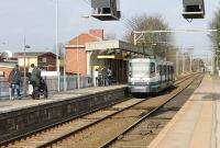 An unusual arrangement applies at Navigation Road station. Metrolink trams in both directions use the west side platform as seen here with 1022 calling on the way to Altrincham. The right hand platform is used by Northern main line services from Chester to Manchester and both systems are single track through the platforms (with only the Metrolink line having an overhead wire these days) but revert to double on either side of the station.<br><br>[Mark Bartlett 08/03/2012]