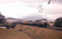 It's summer 1961, as two Birmingham Type 2s cross the Spey just south of Newtonmore at the head of a southbound passenger train, complete with Travelling Post Office.<br><br>[Frank Spaven Collection (Courtesy David Spaven) //1961]