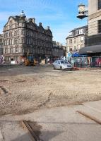 An eerily deserted west end of Edinburgh Princes Street, overlooked by the 'Binns Clock', as the normally packed roads are prepared for tram track laying on 6 March 2012. <br><br>[Bill Roberton 06/03/2012]