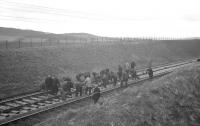 Permanent way squad at work on Easter Sunday 1963 during the reballasting of Kilruskin cutting near West Kilbride. Hi-vis what...? <br><br>[R Sillitto/A Renfrew Collection (Courtesy Bruce McCartney) 14/04/1963]