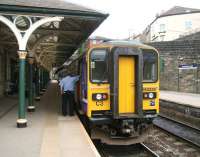 The terminated 11.59 ex-Leeds stands at Knaresborough station on 24 April 2009. The DMU will shortly run forward onto Knaresborough Viaduct (behind camera) before crossing over to platform 1 where it will form the 13.05 service back to Leeds. [See image 23671]<br><br>[John Furnevel 24/04/2009]