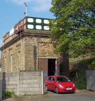 The former water tower at Settle was in the throes of its successful conversion into a house by ex-Friends of the Settle and Carlisle Line chairman Mark Rand and his wife Pat when this picture was taken in April 2011. The project featured in the Channel 4 programme 'The Restoration Man'.<br><br>[Andrew Wilson 18/04/2011]