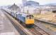 A southbound passenger train at Craven Arms on 18 August 1979 double-headed by 25122+25156.<br><br>[Peter Todd 18/08/1979]