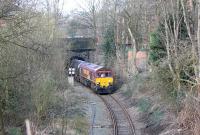 66167 emerges from Fishergate Tunnel straight onto the 1:29 climb back to the main line with fourteen empty bitumen tanks from Preston Dock to Lindsey Refinery at Immingham. This section of the short but very interesting branch is hemmed in on all four sides, and in fact if you don't know it is there you cannot see it from the surrounding roads. This view taken from the overbridge on Walton's Parade.  <br><br>[Mark Bartlett 16/03/2012]