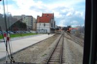 The narrow gauge Tua line followed the river of that name for some 84 miles to Braganca. Mirandela was the main intermediate point where engines were changed and the station had restaurant facilities, The old station is seen here, after its replacement by a transport interchange [See image 37824], from a railbus standing in the new platforms waiting to depart for Tua, 34 miles and two hours away, on the now closed line.<br><br>[Mark Bartlett 18/03/2008]