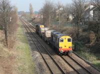 Having reversed at Morecambe station 20308 leads 20309, with the nuclear fuel flasks from Heysham Power Station, towards Bare Lane (beyond the distant overbridge) where they will take the chord to Hest Bank and then the Cumbrian Coast line to Sellafield where the load will be reprocessed.<br><br>[Mark Bartlett 06/03/2012]