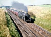 72004 <I>'Clan MacDonald'</I> with a Glasgow - Leeds train south of Lugton in the summer of 1959.<br><br>[A Snapper (Courtesy Bruce McCartney) 22/08/1959]