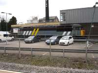 Former Fastline 56302 stabled in front of Cardiff Panel Box building on the south side of Cardiff Central Station on 20 March 2012. Its rake of empty steel wagons stood alongside the main line near Canton depot. <br><br>[David Pesterfield 20/03/2012]