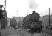 Scene at St Margarets during the summer of 1966, with Black 5 No. 45483 receiving some attention on the south side of the shed.<br><br>[David Spaven //1966]