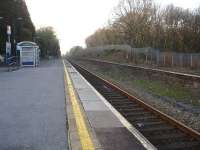 View west at Gowerton station in March 2012 showing the disused upside platform and trackbed that are planned to be brought back into use by 2014 as part of the re-doubling of track through to Llanelli. <br><br>[David Pesterfield 14/03/2012]