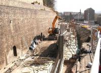 Work in progress on the Waverley route trackbed at Galashiels on 26 March 2012. View south east along Ladhope Vale from above the tunnel towards the site of the new station. Note the substantial new wall currently under construction between the trackbed and the A7. [See image 41638]<br><br>[John Furnevel 26/03/2012]