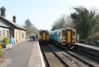 Two Central Wales line services cross at Llanwrtyd and also exchange their crews. 153320 is heading from Shrewsbury to Swansea while 153367 on the left is making the northbound trip. The station actually serves Llanwrtyd Wells, the <I>Smallest town in Wales</I>, and the platform signs also displayed this, but the official name is the plain one.  <br><br>[Mark Bartlett 24/03/2012]