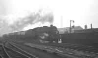 A northbound freight hauled by 8F 2-8-0 no 48631 approaching Wigan North Western on 25 November 1967 (thought to be the Winnington - Whitehaven ICI train). The primary reason for the gathering of photographers in the background is the MRTS <I>Mancunian</I> special hauled by 60019 'Bittern' which called that day with a railtour from Leeds City. [See image 30774] <br><br>[K A Gray 25/11/1967]