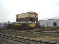 Cardiff Canton steam era east end water tank on 15 March 2012 with an access hole cut into the west side. Freightliner 66615 had been stabled alongside from the previous day. <br><br>[David Pesterfield 15/03/2012]