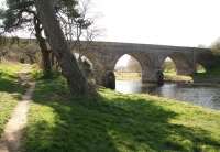 Heading north out of Tweedbank the Waverley line crossed the River Tweed to reach Galashiels via this substantial 5-arch sandstone structure, (known as the Red Bridge or Redbridge Viaduct), currently part of a walkway. View west along the river on 26 March 2012 with the site of the planned Borders Railway terminus around half a mile off to the left.<br><br>[John Furnevel 26/03/2012]