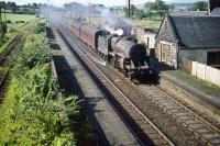 One of Ayr shed's 'Crab' 2-6-0s no 42879 heads north through Lochside in August 1959 with a Glasgow train.<br><br>[A Snapper (Courtesy Bruce McCartney) 22/08/1959]