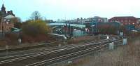 View west towards Thornaby station in March 2004. The station is located to the west end of Tees Marshalling Yard. It is passed by two freight only lines running to the north of the island platform, these join the main line immediately to the west of the station at a single lead junction with a crossover further west on two main line tracks.<br><br>[Ewan Crawford 20/03/2004]