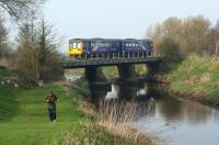 An Ormskirk to Preston service crosses the River Douglas having just called at Rufford on 23 March 2012.<br><br>[John McIntyre 23/03/2012]