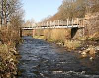 Northbound trains leaving Galashiels made their first crossing of the Gala Water just under a mile from the station. The photograph looks north along the river in March 2012. To the left the Waverley Route and the Peebles Loop began to diverge at Kilnknowe Junction before the latter turned west towards Clovenfords.<br><br>[John Furnevel 26/03/2012]