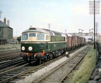 BRCW Type 2 no D5322, delivered new to Haymarket shed some 4 months earlier, photographed with a westbound freight at Saughton Junction in August 1959. The train has recently joined the E&G off the 'sub' at Haymarket West Junction and is about to cross over to the Fife lines before heading north.<br><br>[A Snapper (Courtesy Bruce McCartney) 27/08/1959]