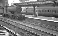 The 12.25pm (SO) from Hawick runs into Carlisle station on 3 September 1960 behind D34 4-4-0 no 62488 <I>Glen Aladale</I>, about to pass a lady with a lot of luggage. The locomotive was withdrawn from Hawick shed the following month and cut up at Cowlairs 3 months later.<br><br>[K A Gray 03/09/1960]