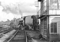 Preserved Black 5 (though actually a 'Green 5' at the time) No. 44932 passes Carnforth East Junction box heading towards Leeds at just after 6pm on 21 September 1974. The train is the 'White Rose' railtour on its way back to Leicester. The Carnforth - Leeds leg of this tour was booked for No. 4771 Green Arrow, which had taken the 'Red Rose' tour from Leeds to Ravenglass earlier that day, but the V2 had failed after arrival light engine back at Carnforth.<br><br>[Bill Jamieson 21/09/1974]