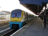 175009 lays over at Carmarthan on 14 March after arriving as the 11.30 from Manchester Piccadilly. Meantime 153323 stands further along the platform with the 15.09 Pembroke Dock to Swansea service.<br><br>[David Pesterfield 14/03/2012]