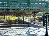 Any old iron...??? The neglected and decaying canopies above the overgrown former excursion platforms at the south end of Tynemouth station in the summer of 2004. The area has been cordoned off from the main part of the station using metal barriers. [See image 38207]<br><br>[John Furnevel 10/07/2004]