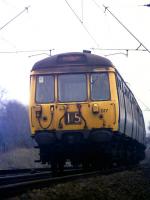 On a dull day in early March 1976, class 303 unit no 017 approaches Cardross with an Airdrie to Helensburgh Central service.<br><br>[John McIntyre /03/1976]