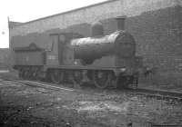 Ex L&Y 0-6-0 no 52523, minus one or two key components, stands abandoned in the rain behind Bolton shed on 29 June 1963. [See image 36976]<br><br>[K A Gray 29/06/1963]