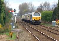 The <I>'Sandgrounder'</I> railtour, with 67029 leading and 67005 at the rear, photographed approaching Parbold on its return from Southport to London Kings Cross on 31 March 2012. The train was moving very slowly at this point as it was waiting for the earlier service train to clear the section to Wigan Wallgate.<br><br>[John McIntyre 31/03/2012]