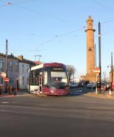 New Flexity tram 001 negotiates Pharos Street in Fleetwood, part of the turnaround loop, and rejoins the double track section with an early evening service to Blackpool on 5 April 2012. The new timetable sees these trams providing a 20 minute interval service between Fleetwood and Starr Gate throughout the day but a 10 minute interval is planned and there will be additional trams on the Cleveleys to Pleasure Beach section.<br><br>[Mark Bartlett 05/04/2012]