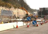 Carriageway width restrictions on the A7 southbound through Galashiels on 26 March 2012, with an accompanying explanatory notice. The new Borders Railway station will be located on this side of the 2-storey  building standing in the centre-right background [currently boarded up awaiting demolition] [see image 28730].<br><br>[John Furnevel 26/03/2012]