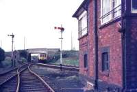 A Newquay - Par DMU approaching St Dennis Junction signal box in August 1987. View is north west from the Meledor Mill branch.<br><br>[Ian Dinmore /08/1987]