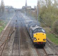 Following a 50 minute stop at Preston, the Pathfinder 'Easter Chieftain' railtour leaves Preston on 6 April and heads north to its next stop at Penrith. The tall church spire in the background is that of St Walburghs, which stands next to the railway just north of Preston station between the WCML and the line to Blackpool.<br><br>[John McIntyre 06/04/2012]