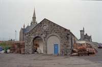 The former Fraserburgh locomotive shed in 1997. To the right was the station (now the B9033), goods yard (industrial estates and rough ground) and the harbour which is still in use. [See image 47834]<br><br>[Ewan Crawford 03/02/1997]