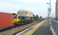 Freightliner 66564 takes containers through Swindon on 22 March 2012.<br><br>[Peter Todd 22/03/2012]