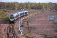 170 471 in the Millerhill turnback siding on 10 April 2012 waiting to form the 17.14 to Dunblane. In the background, test bores are being sunk on the route of the Borders Railway.<br><br>[Bill Roberton 10/04/2012]