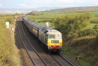 <I>Large Logo</I> Brush 4 No. 47580 nears Carnforth with the Compass Tours <I>Roses Express</I> from Barrow to York on 11 April. At Carnforth the Class 47 handed over to 46115 <I>Scots Guardsman</I> for the next leg via Preston and Copy Pit.<br><br>[Mark Bartlett 11/04/2012]