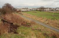 Udny station had a substantial goods yard (now a football pitch). This 1997 view looks north from the former signalbox (foreground, left) towards the station platforms and goods yard. Sadly the station buildings have not survived and housing now stands on the site of the southbound platform building.<br><br>[Ewan Crawford 03/02/1997]