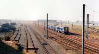 The 10.43 Ayr - Glasgow Central passing the almost deserted Falkland yards on a bright misty morning in March 2012 [see image 8261].<br><br>[Colin Miller 28/03/2012]