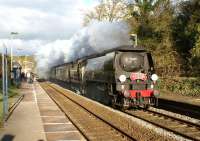 Heading west and with the evening sun illuminating the smokebox, ex Southern Railway Bulleid 'Battle of Britain' class pacific No. 34067 <I>Tangmere</I> makes a fine sight passing through Pleasington station at speed on 12 April 2012 on the return leg of the 'Cumbrian Mountain Express'.<br><br>[John McIntyre 12/04/2012]