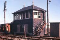 The photographer's youngest son beams from the steps of Crew Junction box in 1966, less than a year after the closure of the Crew Junction-Granton branch of the Coltfield Junction-Leith North goods line. The name board was subsequently purchased from British Railways by the photographer.<br><br>[Frank Spaven Collection (Courtesy David Spaven) //1966]