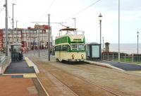 There are still classic trams operating in Blackpool, but only on special heritage services between Pleasure Beach and Little Bispham. Open top Balloon car 706 runs north through Gyn Square on a Promenade Tour service on 14 April 2012. [See image 32859] for the same view just over one year earlier.<br><br>[Mark Bartlett 14/04/2012]