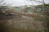 A 1997 view north east over the former station at Maud Junction. The turntable pit and goods yard are in the foreground and the four platforms of the junction station beyond with the buildings now in other uses. The photograph was taken from this angle for comparison with the photograph on the back cover of 'The Story and Tales of the Buchan Line'.<br><br>[Ewan Crawford 03/02/1997]