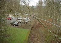 View east over the former station, now a car park, at Grandtully in 1997. Not only did the platform survive but also the goods loading bank [see image 2818], this is in the distance on the left. The trackbed has since been infilled to the level of the platform.<br><br>[Ewan Crawford 05/04/1997]