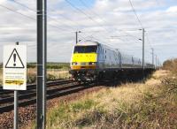 An up East Coast service passing Low Moor Crossing, Northumberland on 5 April heading towards Belford.<br><br>[Brian Taylor 05/04/2012]