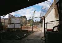 Looking north along Russell Road, Edinburgh on 16 April 2012. Concrete abutments have been cast for the bridge which will carry the tram route over the road and parallel to the Edinburgh - Glasgow/Fife lines which are above the camera.<br><br>[Bill Roberton 16/04/2012]