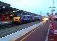 The Caledonian sleeper passing through Rugby on 1 April 2012. As it took two months for everything to come together to get this picture, I would have been annoyed if the Pendolino approaching on the right had got in the way! <br><br>[Ken Strachan 01/04/2012]